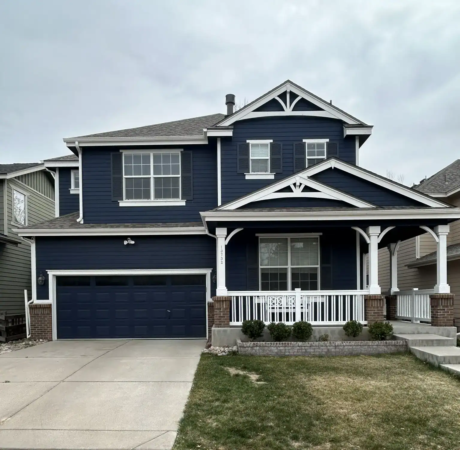 Denver street with colorful homes, greenery, and a “For Sale” sign in a vibrant neighborhood